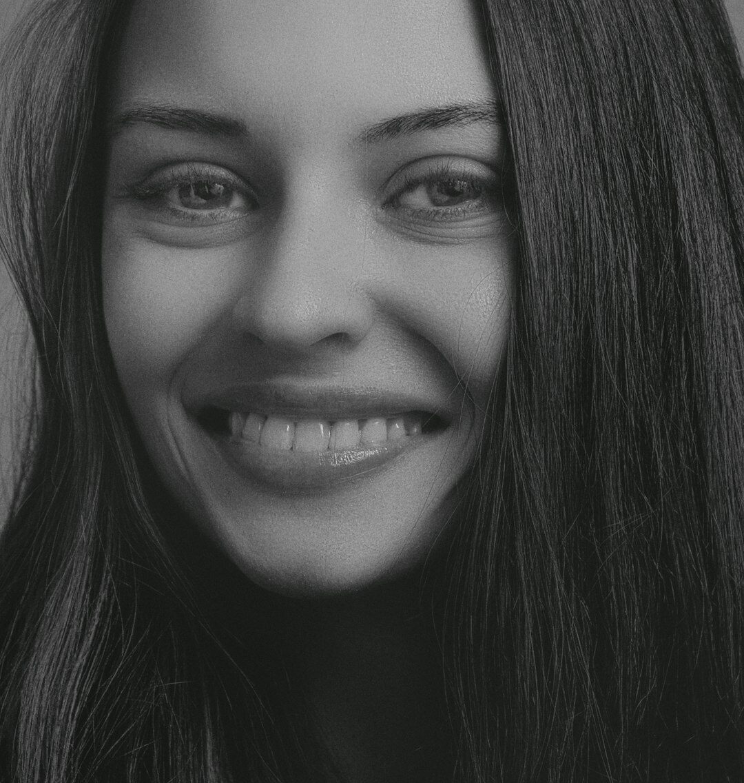 Studio portrait of a Croatian woman in her forties smiling