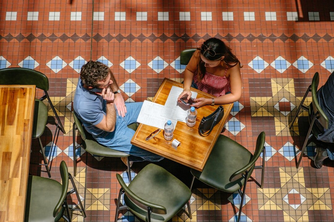 person writing at cafe